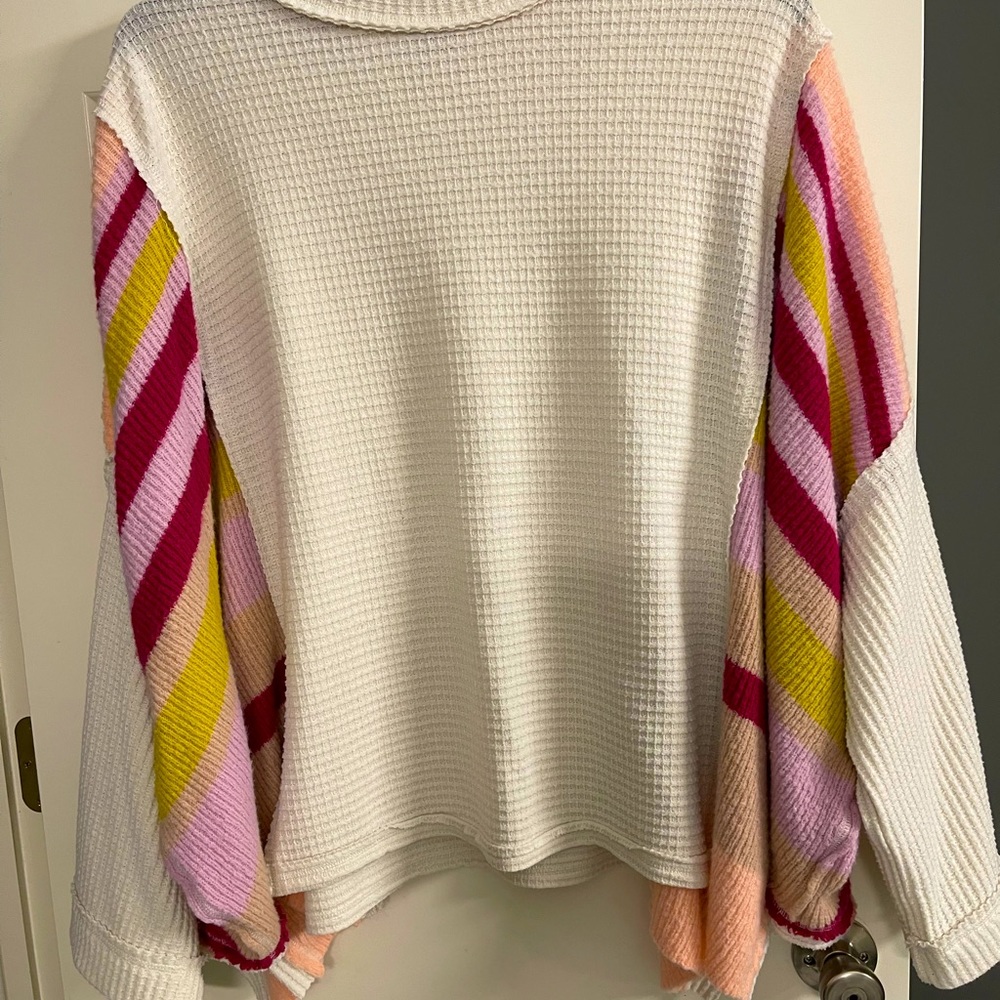 Free People cream and multicolor sleeve sweater size L